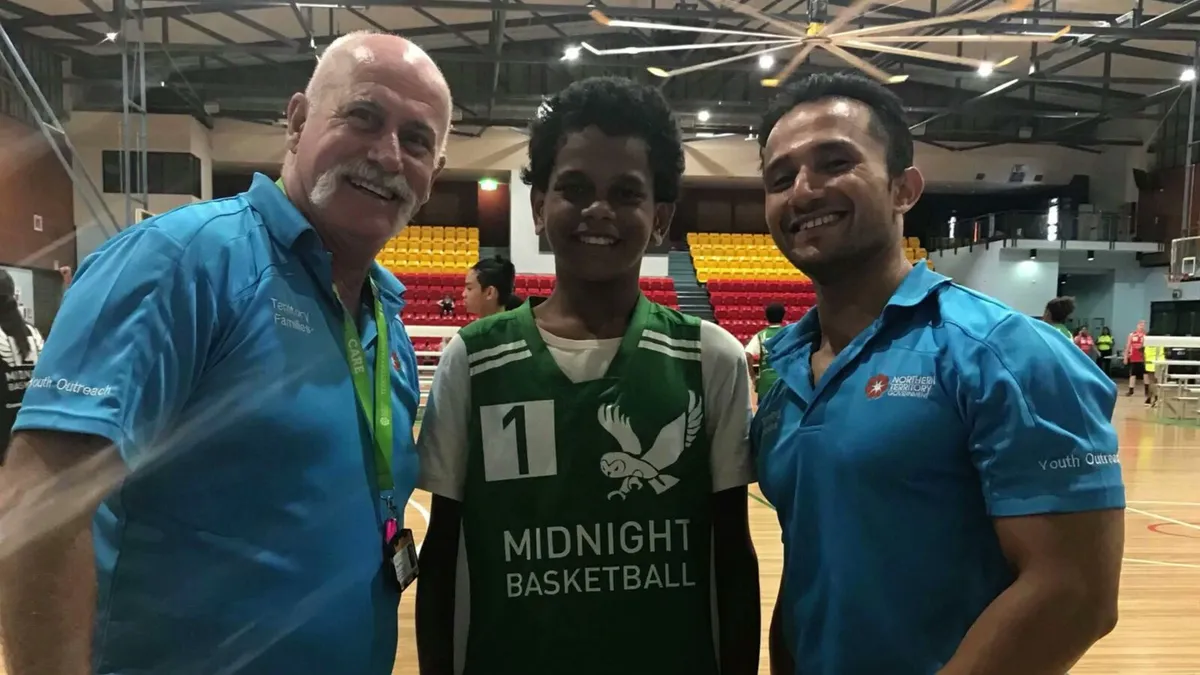 Sol with a young player from Midnight Basketball