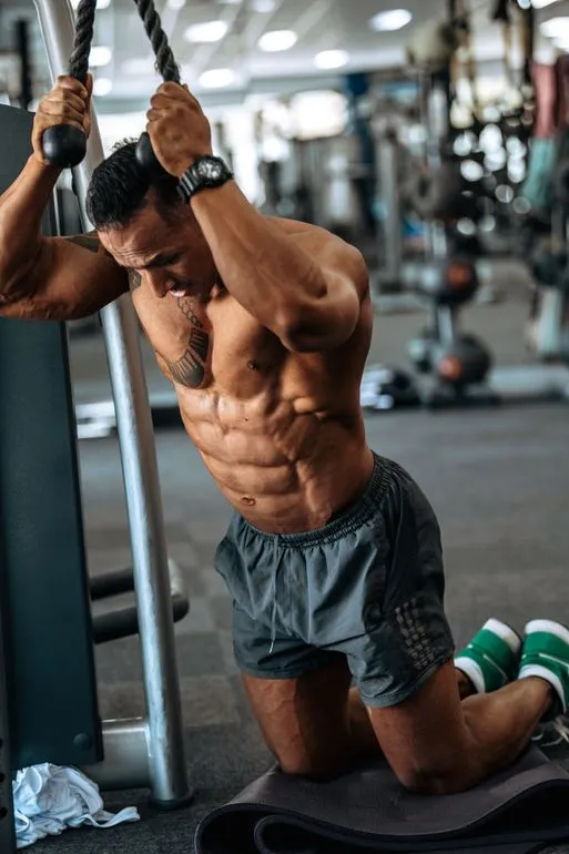 Sol applying his strength-training expertise on the gym floor