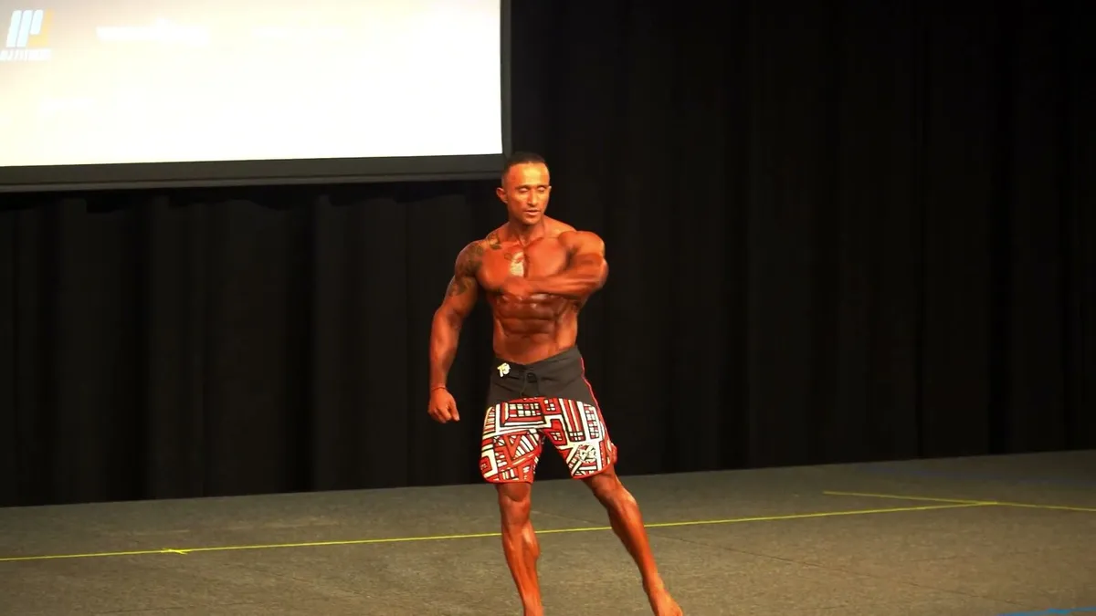 Sol posing alone on stage under the lights